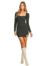 Load image into Gallery viewer, Black ribbed knit mini sweater dress with sweetheart neckline and side slit detail.
