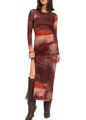 The Solera dress features an abstract wine print and a side slit in a mesh fabrication
