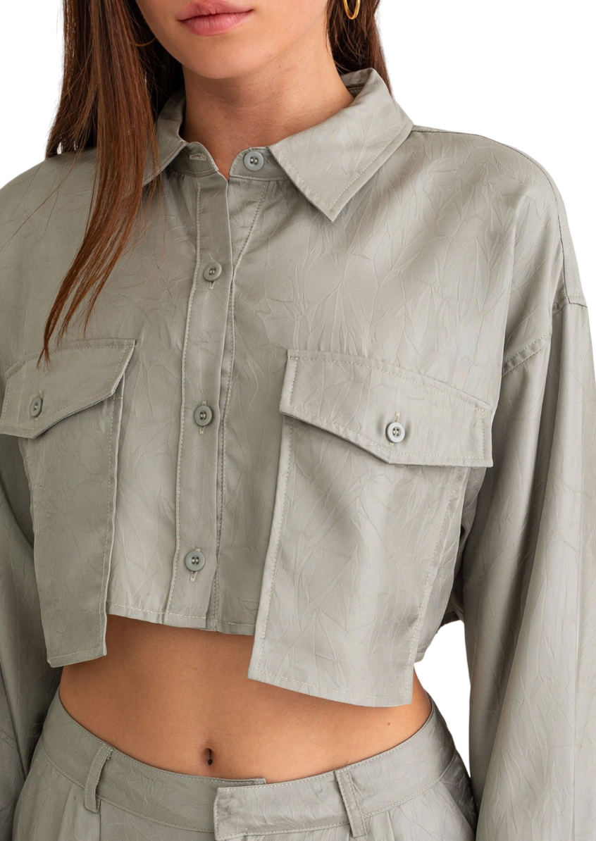 sage cropped button down with extended pocket detail.