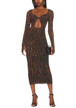 Load image into Gallery viewer, AFRM Maika dress features a twist front with cut-out detail in a beautiful leopard print.
