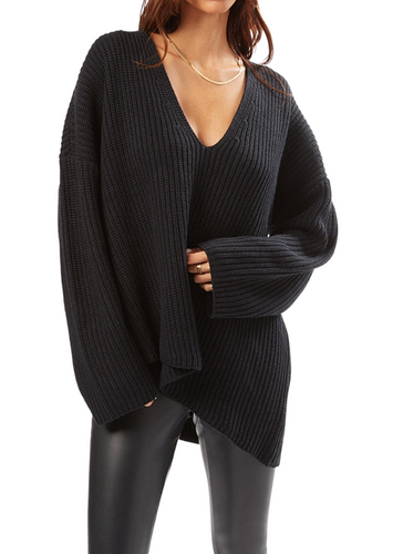Oversized chunky knit v-neck sweater with asymmetrical hem.